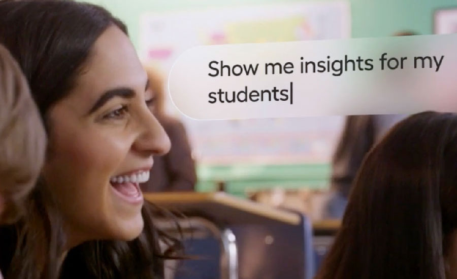 Teacher assisting high school student in class