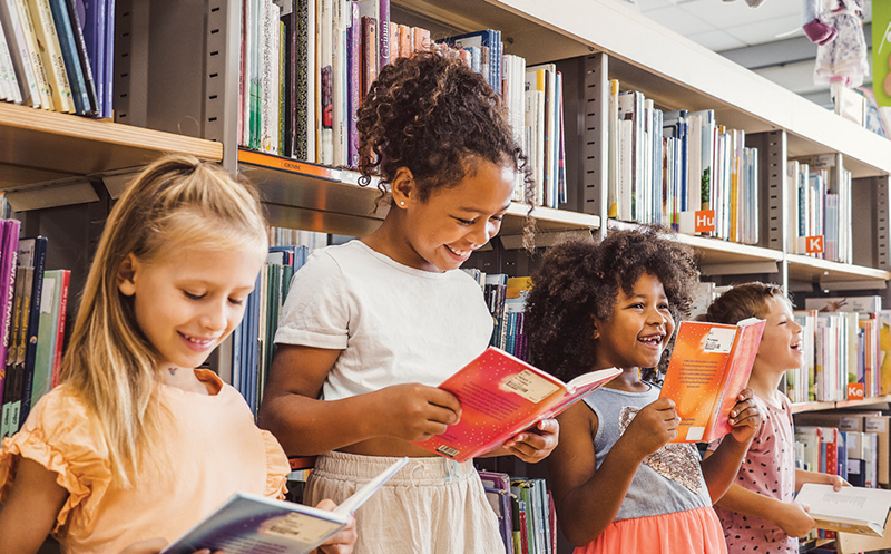 Students reading in a library. 